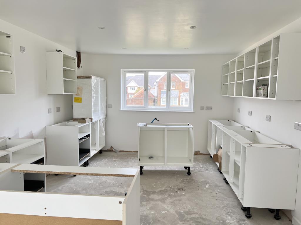 Lot: 125 - FOUR-BEDROOM HOUSE FOR COMPLETION IN POPULAR SETTING - Kitchen area with some cupboard units in place